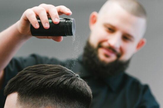 Hair powder applied to mans hair