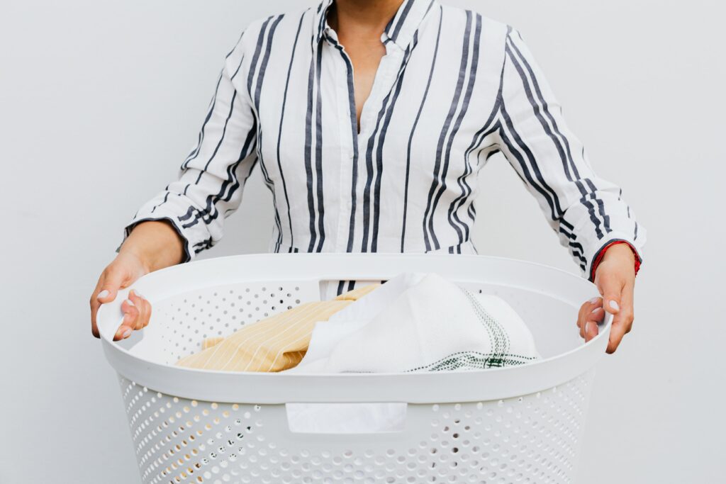 Female holding a washing basket