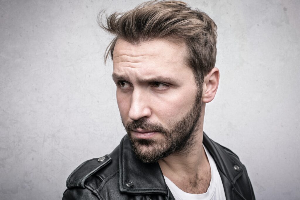 man with stylish hair and leather jacket