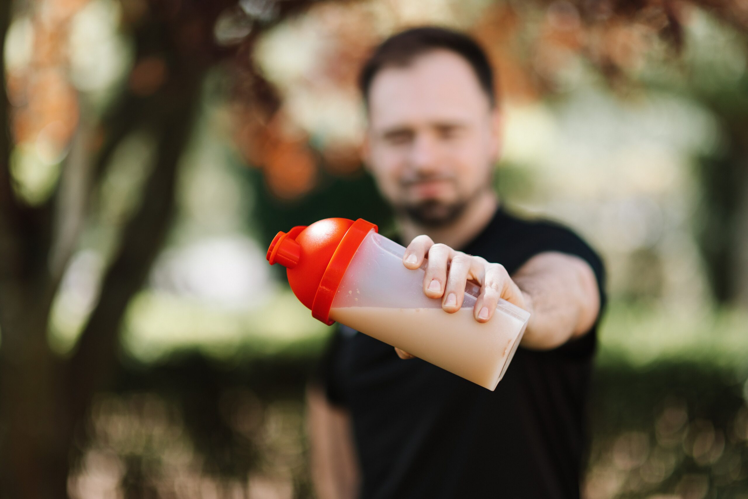 Man holding a protein shaker