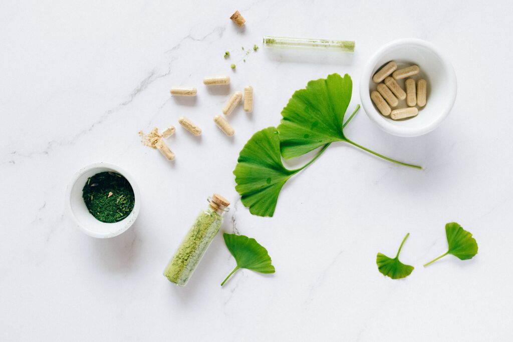 Vitamins and herbs on a worktop