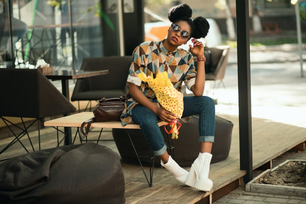 Modern female in funky clothing and shades