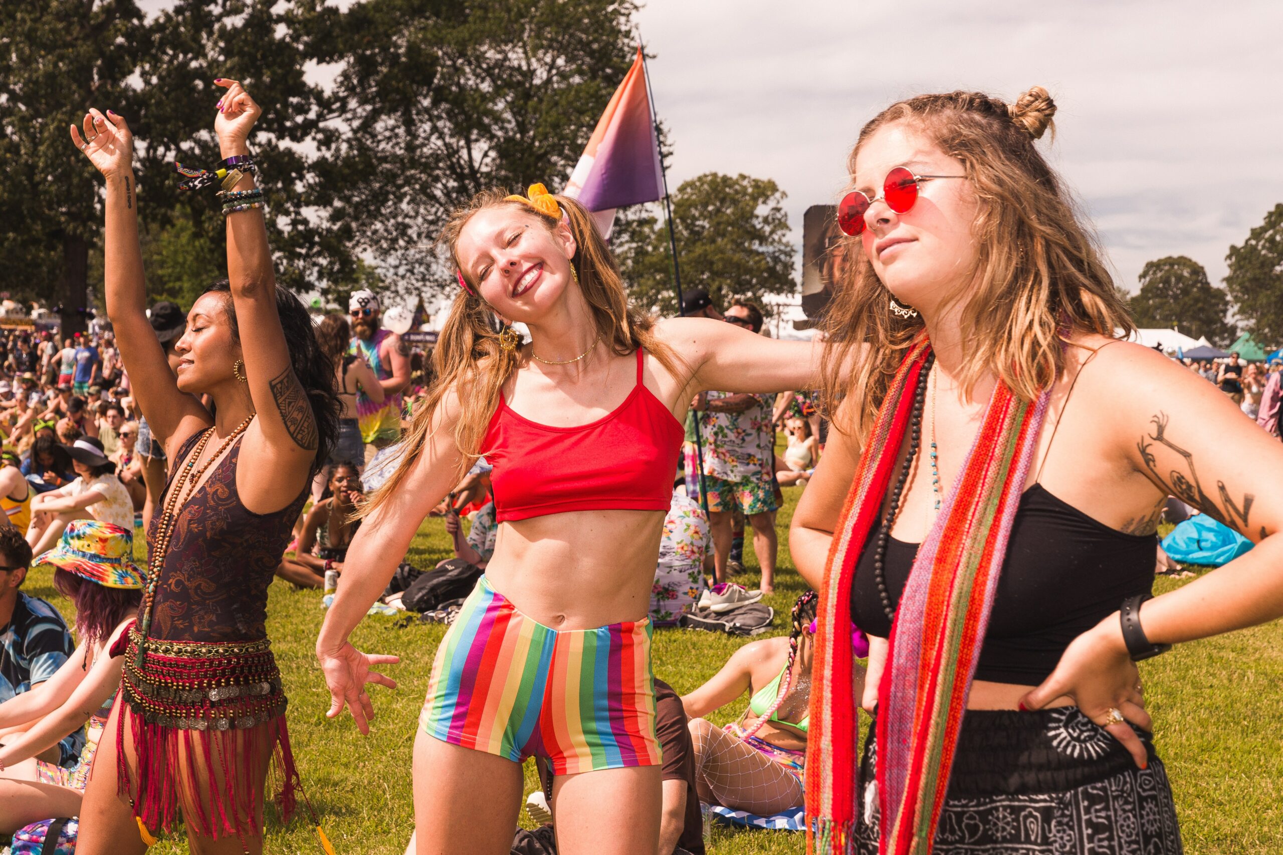 3 young females at a summer festival