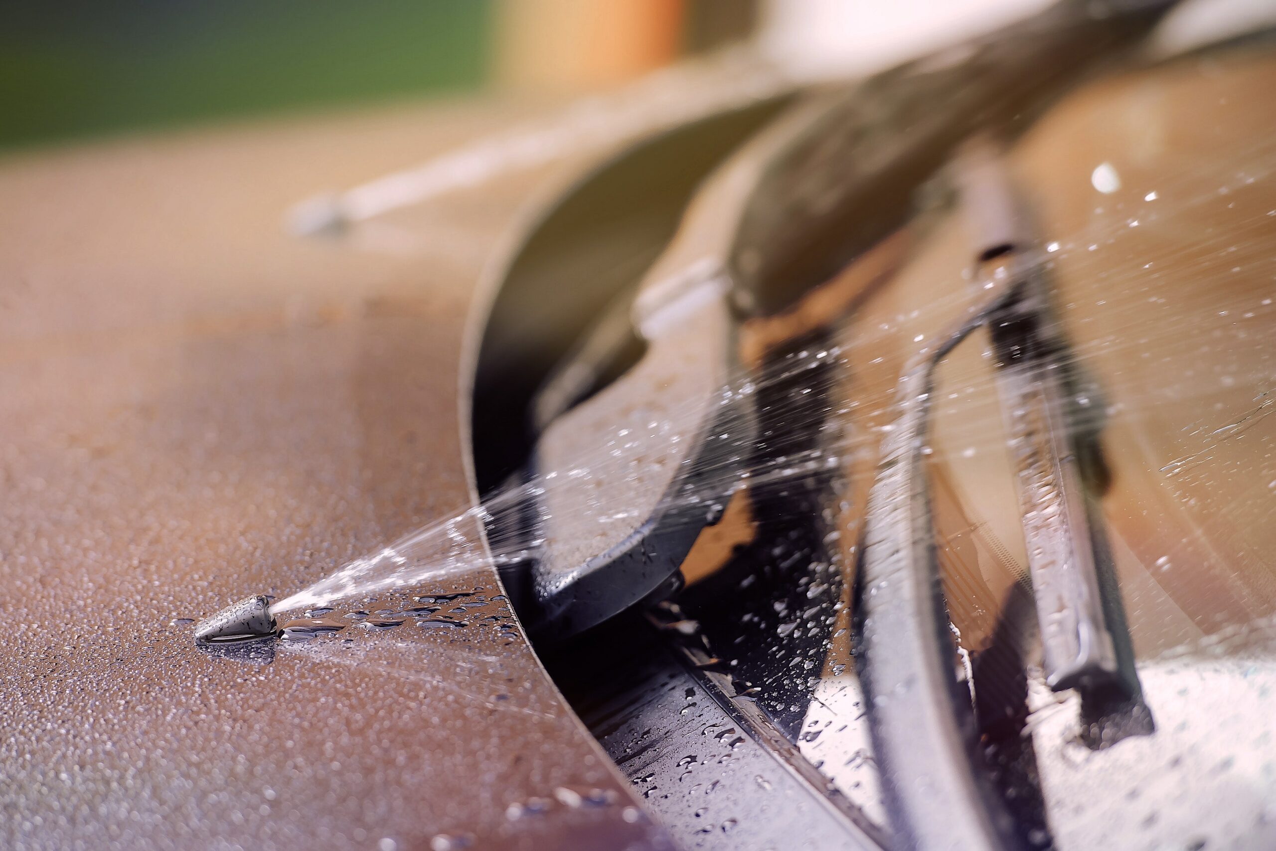 Windscreen washer jets spraying water