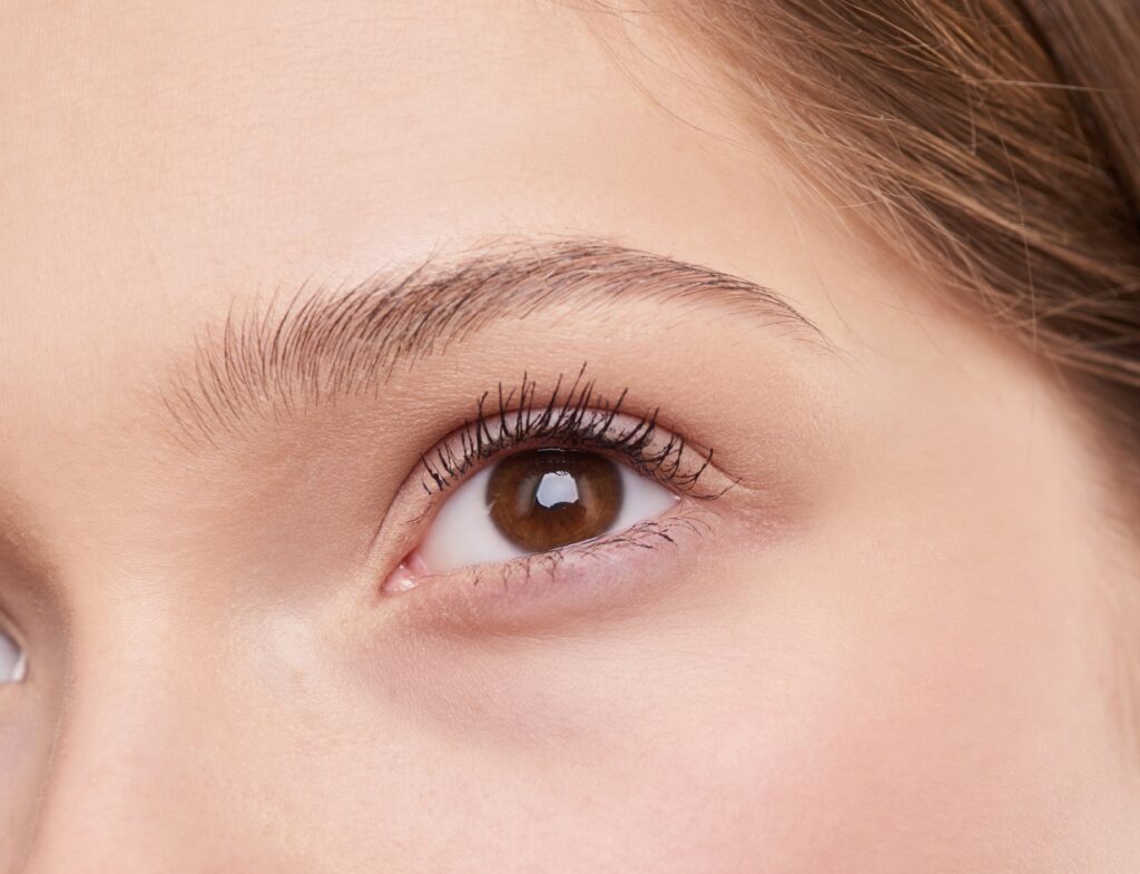 Close up of a female with thin eyebrows